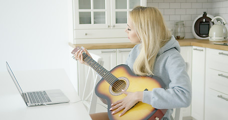 Image showing Woman playing electric guitar