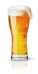 Image showing Light beer in sweaty glass and foam