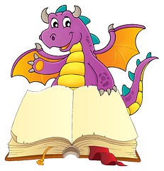 Image showing Open book with happy dragon