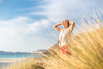 Image showing Free Happy Woman Enjoying Sun on Vacations.