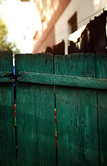 Image showing Green wooden fence in residential district