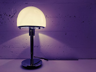 Image showing Modern design table lamp near concrete wall