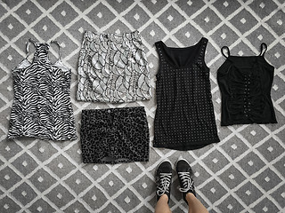 Image showing Choice of stylish clothes on the floor