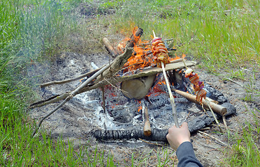 Image showing Teen boy enjoying barbecue 