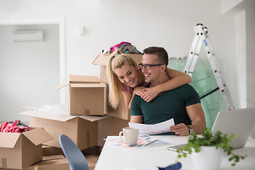 Image showing Young couple moving in a new home