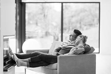 Image showing Young couple  in front of fireplace