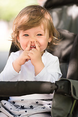 Image showing baby girl sitting in the pram