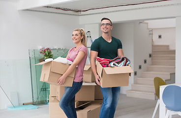 Image showing young couple moving into a new home