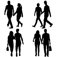 Image showing Set Silhouette man and woman walking hand in hand