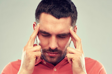 Image showing man suffering from head ache or thinking