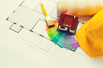 Image showing close up of house blueprint with building tools