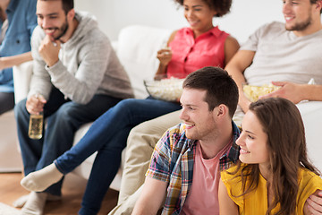 Image showing happy friends watching tv at home