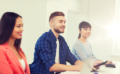 Image showing happy creative team or students working at office