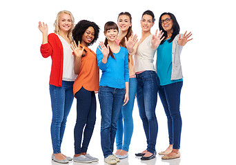 Image showing international group of happy women waving hands