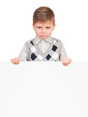 Image showing Little boy peeking from blank board