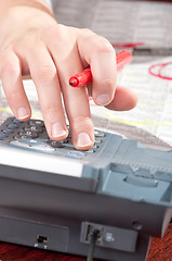 Image showing Hand with marker and phone