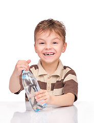 Image showing Little boy with plastic bottle of water
