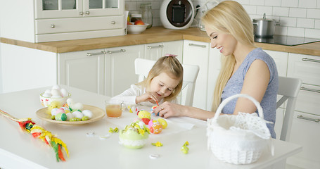 Image showing Loving family coloring Easter eggs