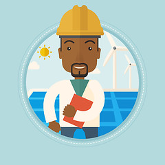 Image showing Male worker of solar power plant and wind farm.