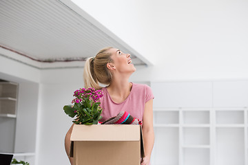 Image showing girl moving in the new apartment