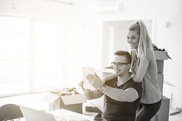 Image showing Young couple moving in a new home