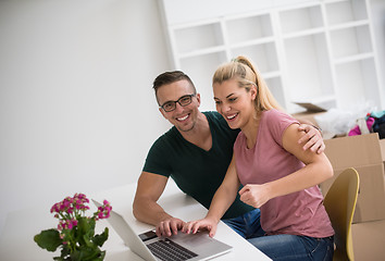 Image showing Young couple moving in a new home