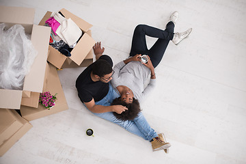 Image showing African American couple relaxing in new house