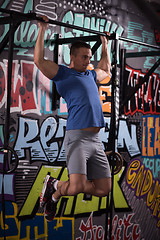 Image showing man doing pull ups