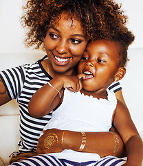 Image showing adorable sweet young afro-american mother with cute little daugh