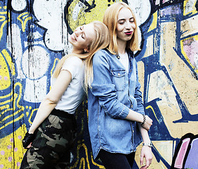 Image showing two cool blond real girls friends making selfie on roof top, lif