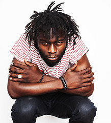 Image showing young handsome african american boy singing emotional with microphone isolated on white background, in motion gesturing 