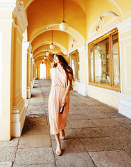 Image showing young pretty smiling woman in hat with bags on shopping at store