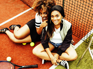 Image showing young pretty girlfriends hanging on tennis court, fashion stylis