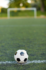 Image showing soccer ball on football field marking line