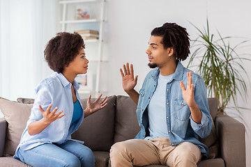 Image showing unhappy couple having argument at home