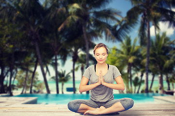 Image showing woman making yoga meditation in lotus pose