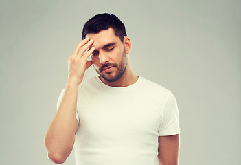 Image showing young man suffering from headache