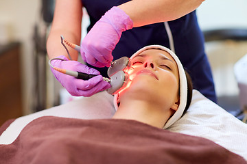 Image showing young woman having face microdermabrasion at spa