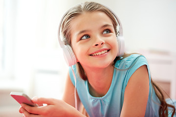 Image showing close up of girl with smartphone and headphones