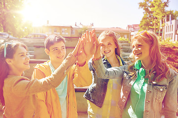 Image showing happy students or friends making high five