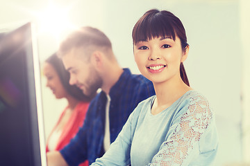 Image showing happy creative team or students working at office