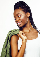 Image showing young pretty african-american girl posing cheerful emotional on white background isolated, lifestyle people concept 