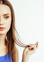 Image showing young pretty teenage hipster girl posing emotional happy smiling on white background, lifestyle people concept 