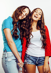 Image showing best friends teenage girls together having fun, posing emotional on white background, besties happy smiling, lifestyle people concept close up