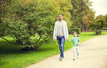 Image showing happy family walking in summer park
