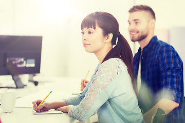 Image showing happy creative team or students working at office