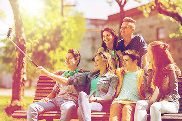 Image showing happy teenage students taking selfie by smartphone