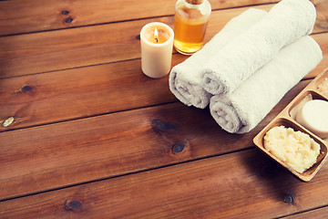 Image showing close up of natural cosmetics and bath towels