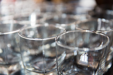 Image showing empty old-fashioned glasses at bar