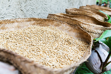 Image showing unroasted coffee beans in baskets at street market